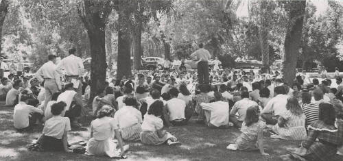 Vice-President H.D. Richardson Greets the Freshman Assembly Held Under the Trees