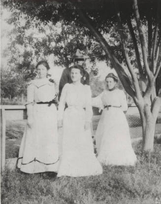 Three Coeds with a Friend by the Pasture Fence on South Campus