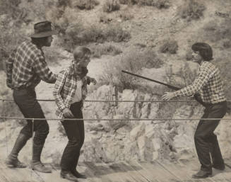 Three Actors on Suspension Footbridge in a Scene from "Blue Jay Summer"