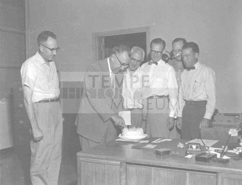 Administrators Sharing Cake with President Gammage