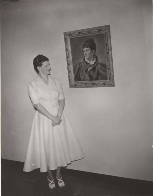 Mrs. Kathryn Gammage Standing Next to a Portrait of Andree Ruellan