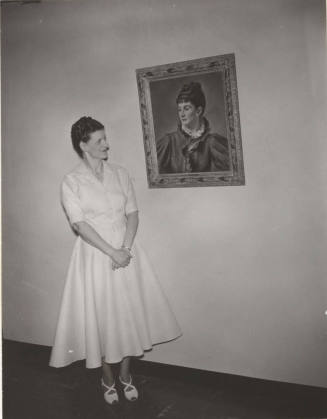 Mrs. Kathryn Gammage Standing Next to a Portrait of Andree Ruellan