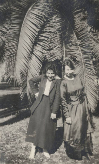 2 Coeds Standing by a Date Tree