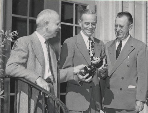 Ira D. Payne Showing Replica of Sun Devil to a Member of 1914 Class