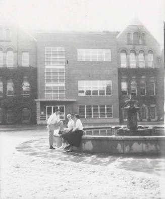 Students Sitting in Front of Old Main