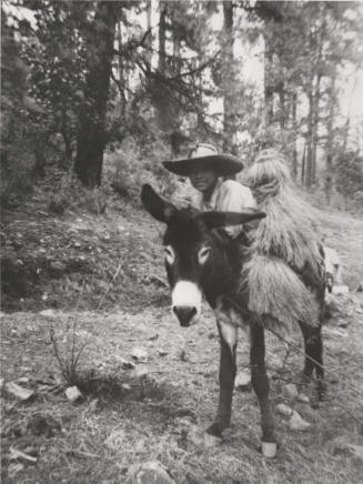 Child on Burro on Hillside