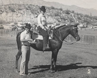 Mitzi Thude in the Saddle on Winning Horse with Trainer Along Side